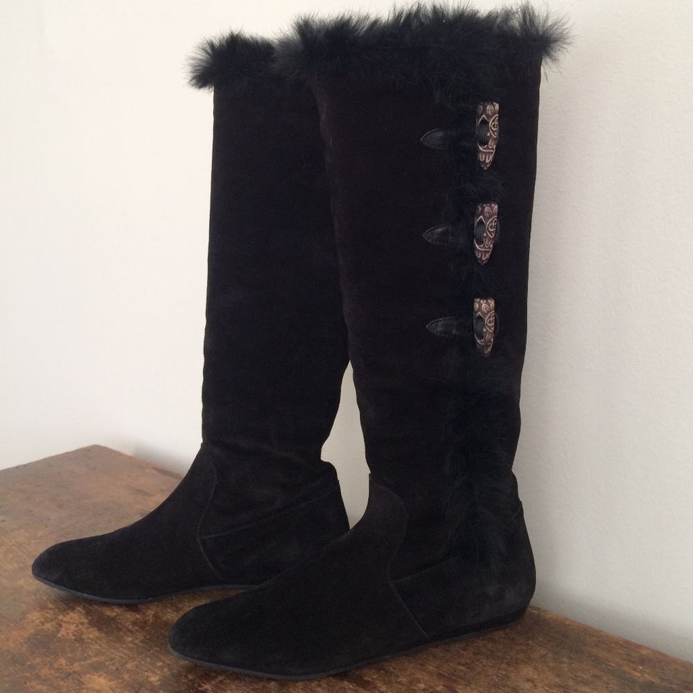 Tall black suede boots lined with fur